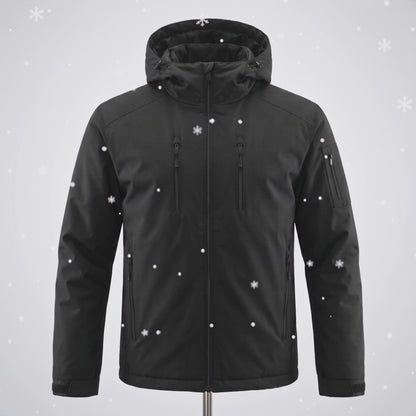 Snow falls on the black Chromapeak jacket and the blue pattern appears